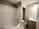 Updated bathroom with subway tile, a bathtub/shower combo, and modern fixtures at 2353 Arno Ct, Atlanta, GA 30318