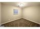 Cozy bedroom with plush carpeting and a large window at 2353 Arno Ct, Atlanta, GA 30318