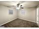 Spacious bedroom with plush carpeting, a ceiling fan, and large windows at 2353 Arno Ct, Atlanta, GA 30318