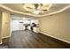 Open-concept kitchen and living area with modern appliances and wood-look flooring at 2353 Arno Ct, Atlanta, GA 30318
