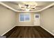 Bright living room with large windows, wood-look flooring, and a ceiling fan at 2353 Arno Ct, Atlanta, GA 30318