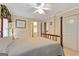 Bedroom featuring wooden poster bed, ceiling fan, and closet at 110 Madison Ave, Peachtree City, GA 30269