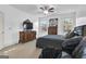 Large bedroom with wooden furniture, soft carpet, ceiling fan, and a TV at 115 Haddonstone Dr, Fayetteville, GA 30215