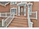 Close-up of the front door with decorative glass at 165 Standing Oak Pl, Fayetteville, GA 30214