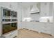 Kitchen featuring stainless steel appliances, white cabinets, and a subway tile backsplash at 714 Magnolia Walk, Peachtree City, GA 30269