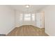 Empty bedroom with large window, neutral carpet, and white walls at 510 Marceau Sw Way, Atlanta, GA 30331