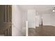 Bright entryway with wood-look floors, white walls, staircase, and view into the open living space at 1019 Cades Walk, Lawrenceville, GA 30045