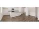 Open kitchen with modern appliances, white cabinets, granite countertops, and a large island at 1019 Cades Walk, Lawrenceville, GA 30045