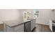 Kitchen with stainless steel appliances, granite countertops, white cabinets, island with a sink, and a dishwasher at 1019 Cades Walk, Lawrenceville, GA 30045
