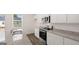 Granite countertops and modern, stainless appliances highlight this open kitchen at 1019 Cades Walk, Lawrenceville, GA 30045