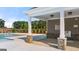 Community pool featuring a covered lounging area and safety signage at 1019 Cades Walk, Lawrenceville, GA 30045