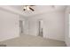 Well-lit bedroom featuring neutral carpet and entry to an ensuite bathroom at 1019 Cades Walk, Lawrenceville, GA 30045