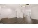 Living area featuring modern wood-look floors, an open layout, and stairs to the upper level at 1019 Cades Walk, Lawrenceville, GA 30045