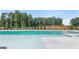 Large community pool with concrete surround and manicured landscaping at 1019 Cades Walk, Lawrenceville, GA 30045