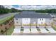 New townhome community featuring gray and white exteriors with private decks and garages at 1019 Cades Walk, Lawrenceville, GA 30045