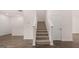 Bright entryway with a carpeted staircase and hardwood floors at 1019 Cades Walk, Lawrenceville, GA 30045