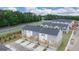 New townhome community featuring gray and white exteriors with private decks and garages at 1019 Cades Walk, Lawrenceville, GA 30045