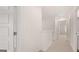 Upstairs hallway featuring neutral carpet and access to bathroom and bedroom at 1019 Cades Walk, Lawrenceville, GA 30045