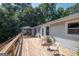 Large wooden back deck with a gazebo overlooking trees. Perfect for outdoor gatherings at 135 Longview Rd, Fayetteville, GA 30214