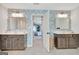 Dual vanity bathroom with floral wallpaper and dark wood cabinets at 205 Creekrise Pl, Palmetto, GA 30268