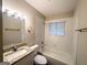 Bathroom with a granite vanity top, white cabinetry, a bathtub, and tiled walls at 1519 Pine Glen Cir, Decatur, GA 30035