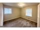 Empty bedroom with neutral walls, carpeting, and two windows with blinds at 1519 Pine Glen Cir, Decatur, GA 30035