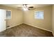 Cozy bedroom with neutral beige carpet, and two windows with blinds at 1519 Pine Glen Cir, Decatur, GA 30035