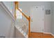 Entryway featuring hardwood floors, a staircase, white door and window at 9028 Aldbury Dr, Locust Grove, GA 30248