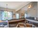 Kitchen with double sink, dark countertops, and view of the dining area at 9028 Aldbury Dr, Locust Grove, GA 30248