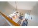 View from above of living room with couches, coffee table, ceiling fan, dining area and fireplace at 9028 Aldbury Dr, Locust Grove, GA 30248