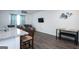 Open-concept living area with a view of the kitchen island, dining table, and comfortable seating at 1304 Speckle Park Way, Stockbridge, GA 30281