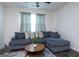 Living room with a sectional sofa, coffee table, and soft rug at 1304 Speckle Park Way, Stockbridge, GA 30281