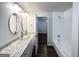 Modern bathroom with dual vanity, glass sinks, and a separate tub/shower at 2556 Godfrey Nw Dr, Atlanta, GA 30318
