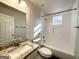 Clean and bright bathroom with a shower/tub combo and granite vanity top at 2556 Godfrey Nw Dr, Atlanta, GA 30318