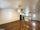 Open-concept living area with hardwood floors, a ceiling fan, and an updated kitchen at 2556 Godfrey Nw Dr, Atlanta, GA 30318