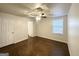 Spacious main bedroom with hardwood floors, a ceiling fan, and an ensuite bathroom at 2556 Godfrey Nw Dr, Atlanta, GA 30318