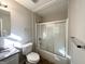 Clean bathroom with a granite vanity, shower/tub combo, and modern fixtures at 261 Howell Sw Ter, Atlanta, GA 30331