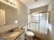 Bathroom features granite vanity, shower/tub combo, and tile floor at 261 Howell Sw Ter, Atlanta, GA 30331