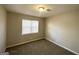 Spacious bedroom with carpeted flooring and ample natural light at 261 Howell Sw Ter, Atlanta, GA 30331