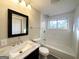Clean bathroom with modern fixtures, marble countertop, and tiled shower at 6069 Wisteria Ln, Lithia Springs, GA 30122
