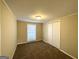 Cozy bedroom with carpeted floors, neutral walls, and closet at 6069 Wisteria Ln, Lithia Springs, GA 30122
