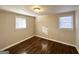 Well-lit bedroom with hardwood floors and large windows at 6069 Wisteria Ln, Lithia Springs, GA 30122