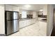 Modern kitchen with white cabinets, granite counters, and stainless steel appliances at 6069 Wisteria Ln, Lithia Springs, GA 30122