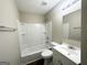 Clean and bright bathroom with a white bathtub, vanity, and toilet at 2843 Marco Nw Dr, Atlanta, GA 30318