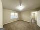 Cozy bedroom with neutral walls, plush carpeting, and ample natural light at 4372 Cook Pl, Decatur, GA 30035