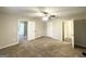 Spacious bedroom with carpeted flooring, ceiling fan, and closet at 5118 Millard Ct, Stone Mountain, GA 30088