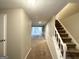 Inviting entryway with carpeted stairs leading to the second floor at 5118 Millard Ct, Stone Mountain, GA 30088