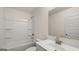 Bathroom with white tub, vanity, and fixtures at 671 Edgar St, Hampton, GA 30228