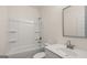 Clean bathroom with white fixtures, a shower/tub combo, and a single vanity at 671 Edgar St, Hampton, GA 30228