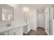 Modern bathroom with double vanity, white cabinets, and walk-in shower at 671 Edgar St, Hampton, GA 30228